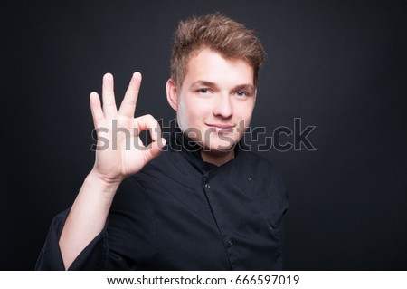 Confident male chef showing ok gesture