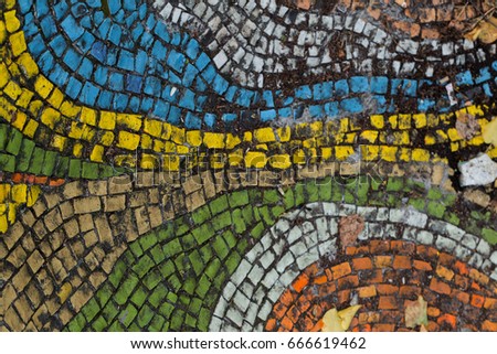 Detail of beautiful old collapsing abstract ceramic mosaic adorned building. Venetian mosaic as decorative background. Selective focus. Abstract Pattern. Abstract mosaic colored  ceramic stones