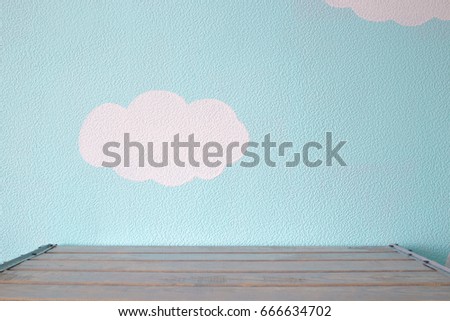 Heavenly blue wall and empty wooden table