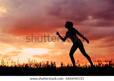 Outdoor silhouette fitness woman runner.