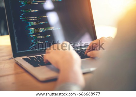 Closeup coding on screen, Woman hands coding html and programming on screen laptop, development web, developer. Royalty-Free Stock Photo #666668977