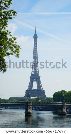 View on Eiffel Tower and urban street in Paris, France