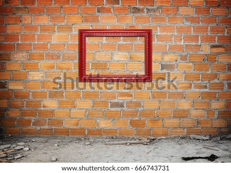 red frame on brick wall,  vintage background.
