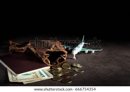 Preparation for Traveling concept , airplane , money, passport on dark background with copy space , Traveling concept