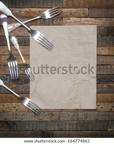 Vintage antique forks on old wooden background flat lay food blog mockup, copy space