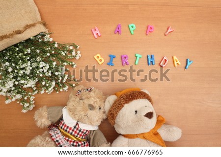 Happy Birthday,Daisy flowers with a tag Happy Birthday on wooden background