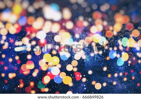 abstract blurred of blue and silver glittering shine bulbs lights background:blur of Christmas wallpaper decorations concept.xmas holiday festival backdrop:sparkle circle lit celebrations display.