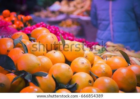 Oranges at the market; oranges with leaves