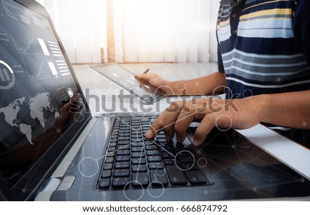 Designer  working at office. Digital tablet laptop computer smart phone using, keyboard. Connection internet application online. Finance manager. Banking. Professional investor. Businessman