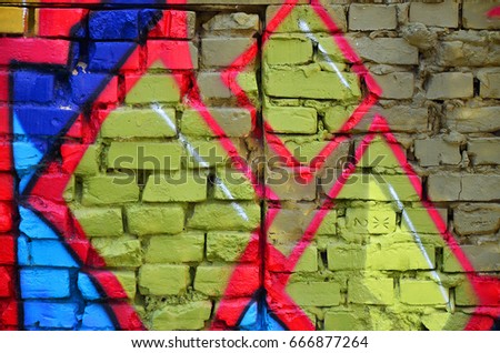 Detailed image of color graffiti drawing. Background street art picture. Part of the colorful masterpiece by the professional graffiti artist