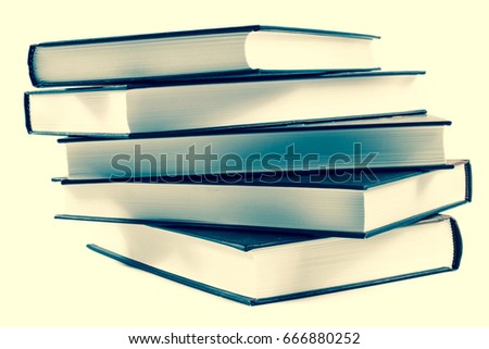 stack of ald books isolated on white