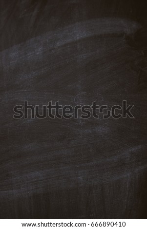 Black chalk board texture background with chalk rubbed out, vertical view.