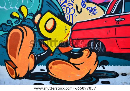 A detailed image of the graffiti drawing. A conceptual street art background with cartoon characters