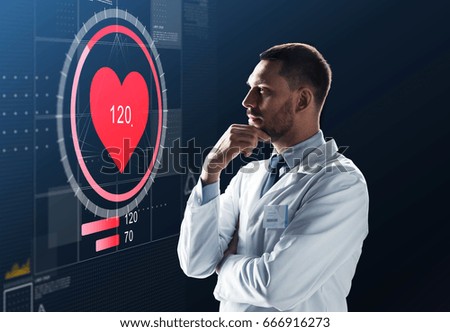 medicine, cardiology and healthcare concept - male doctor or scientist in white coat looking at heart rate projection on virtual screen over black background