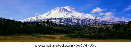 Mount Shasta in Northern California. Snow mountains and valleys.