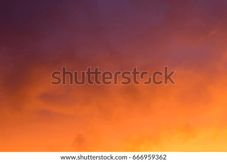 Background of the orange evening sky and amazing clouds.
