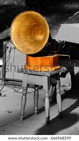 Old gramophone on a stool in the park