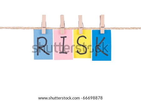 Risk, Colorful words hang on rope by wooden peg