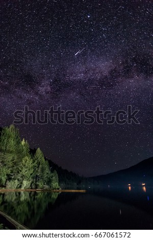 Starry Sky Over Lake With A Shooting Star