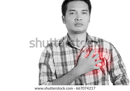 young man holding her chest in pain. monochrome photo with red as a symbol for the hardening. isolated on white background.