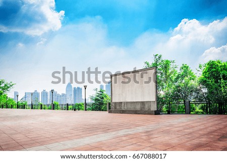 City park under blue sky with Downtown Skyline in the Background