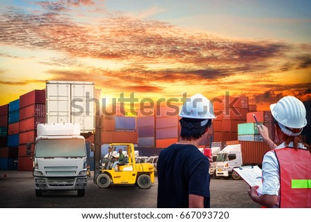 asian two dock worker control loading Containers box to truck for Logistic Import Export Background, Business logistic concept