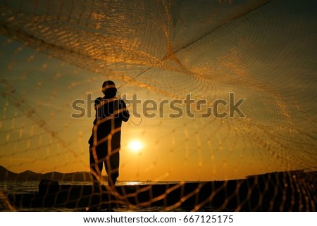 Fishermen are fishing at sunset.