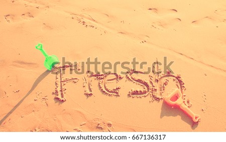 Fresh Written in the Sand on a Beach.