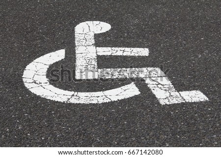 Handicapped Symbol Painted on a Parking Spot. Space for the disabled
