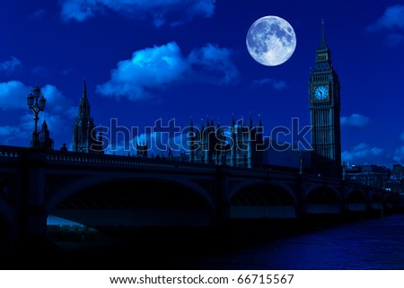Midnight picture of the Big Ben and Westminster Bridge in London with a full moon