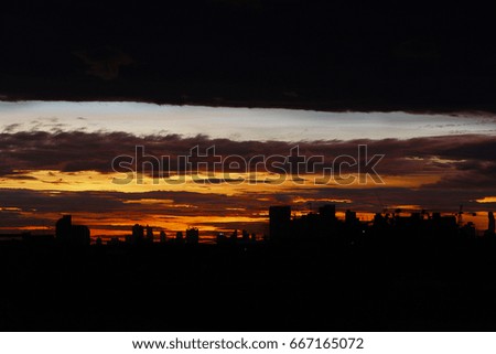 silhouette light of Cityscape view during sunrise in th evening. image for background, wallpaper and copy space.