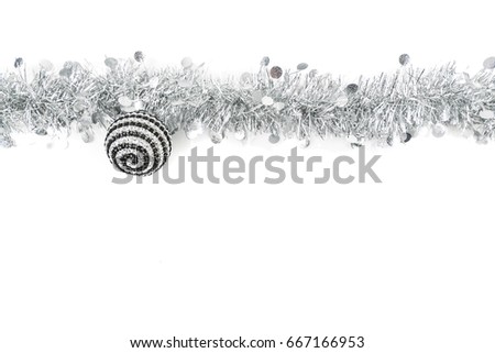 Christmas Garland with black ball on white Background. Top View of Xmas Decoration Close-Up with Text Space