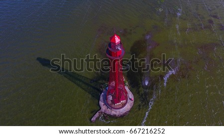 Beautiful lighthouse in the sea. Aerial view