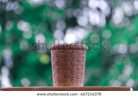 Tree pots on the bokeh tree background with a picture of lifestyle.