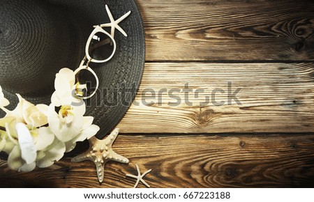 Black fashion hat on the wooden background