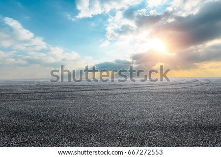 new asphalt road and sky at sunset