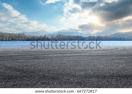 asphalt road and mountain background