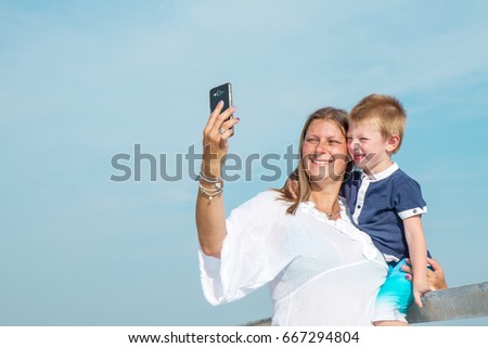 mother and son doing selfie 