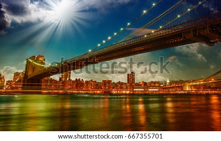 Night sky above Brooklyn Bridge and Manhattan Bridge - New York City.