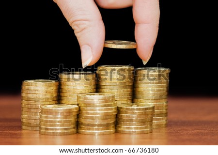 Golden coins on a wooden table