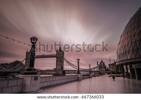 Sunrise clouds by the London Tower Bridge, Long exposure with moving clouds, London Tower Bridge on a early summer morning with moving abstract clouds,London Tower Bridge