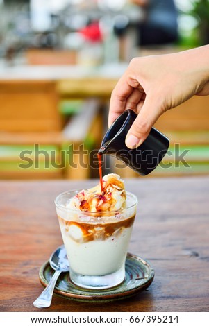 Affogato coffee with ice-cream on wooden plate Royalty-Free Stock Photo #667395214