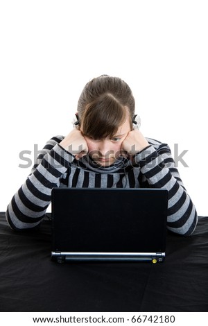 Young teenage girl working with laptop