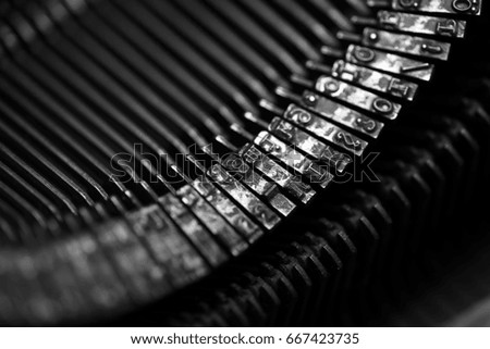 Different small metal elements of an old typewriter macro
