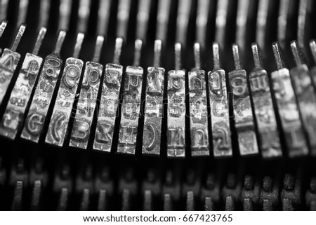 Different small metal elements of an old typewriter macro
