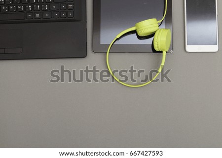 Office desk background,  headphones recording scene project ideas concept, With laptop computer, mobile phones, drawing equipment . View from above with copy space