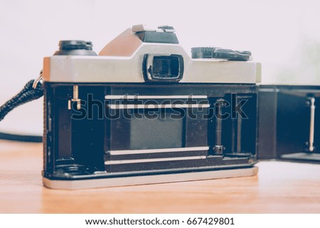 Vintage camera on wooden table