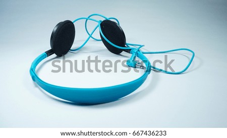 Blue headphones on isolated white background