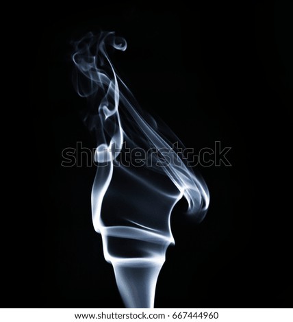 Movement of smoke. The smoke isolated on black background, beautiful white smoke
