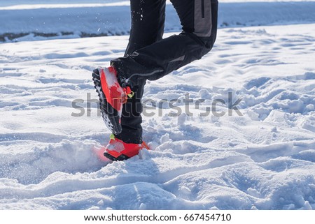 Handsome young runner on the snow.Colored photo